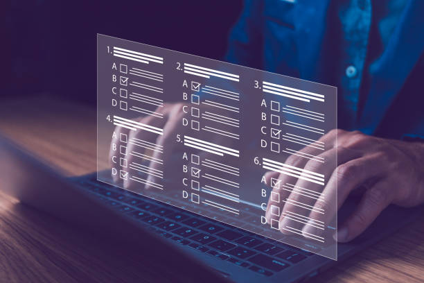 istock Hands interact with a digital survey form on the laptop. Survey form concept. Check marks on checklist and filling online form or answering questions. Customer Experiences and satisfaction concept. 2065696178