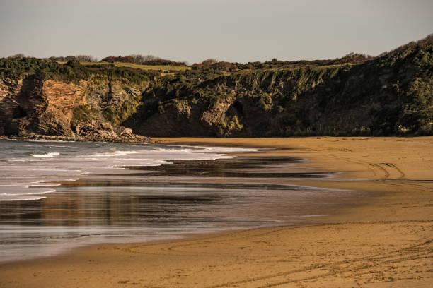 Beautiful beach in the north of Spain. Exploring stunning Spanish coastline in winter time.