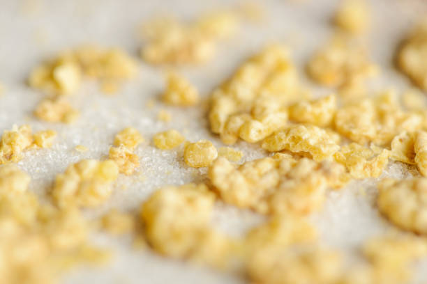 Extreme macro of corn flakes crumbs on sugar crystals