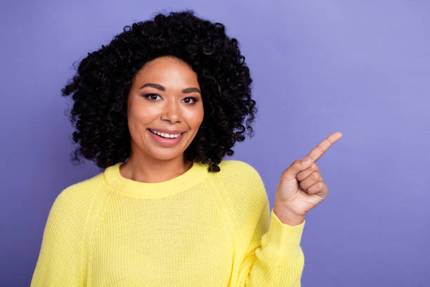istock Portrait of satisfied person wear knit pullover indicating at profitable proposition empty space isolated on purple color background 2065719173