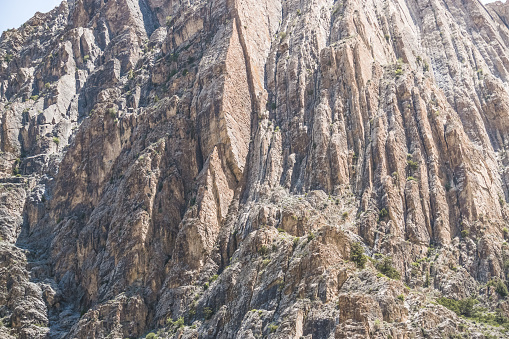 Mountain landscape of the Fan Mountains with rocks, stones and vegetation in Tajikistan, mountain panorama