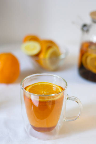 istock Hot tea with orange and lemon in a glass with double 2065731456