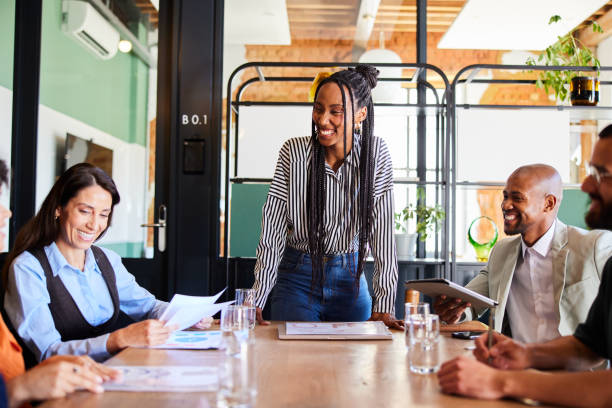 istock Manager and her business team laughing during a board room meeting 2065737414