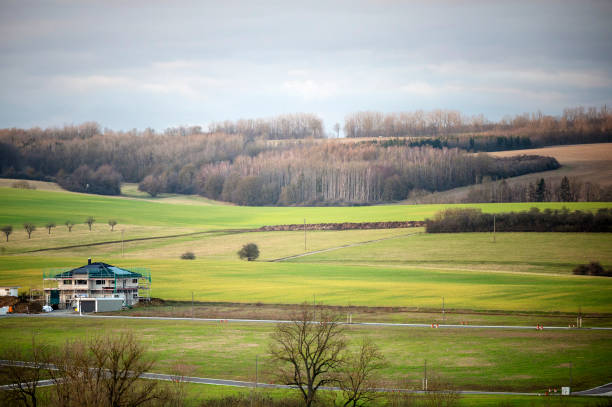 Thuringia, Germany - 17 February 2024: Individual houses stand on a field that is to become a new housing estate.