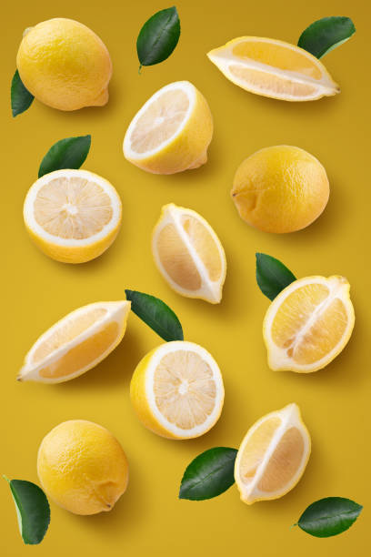 istock Fresh Yellow Lemon and Yellow Lemon slices on a yellow background. Fruit minimal concept 2065790464