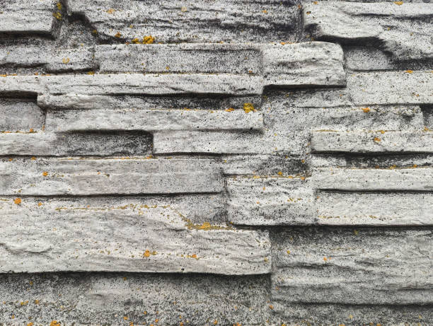 a texture of stone ledges covered with lichen, background, grunge