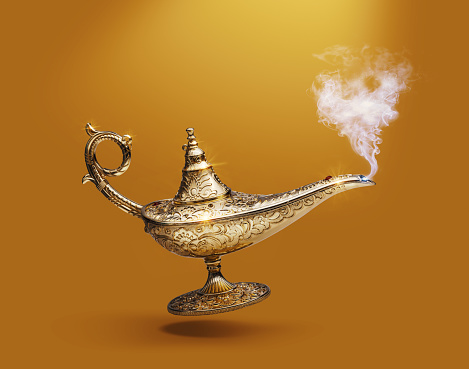 Precious golden magic lamp on gold background, fairy tales and wish fulfillment concept