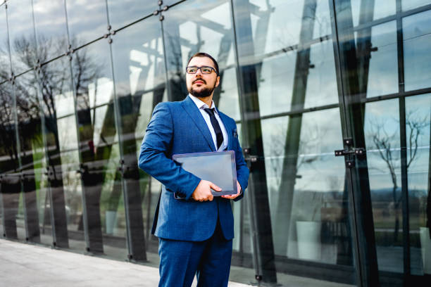 istock Businessman in front of an office building 2065805841