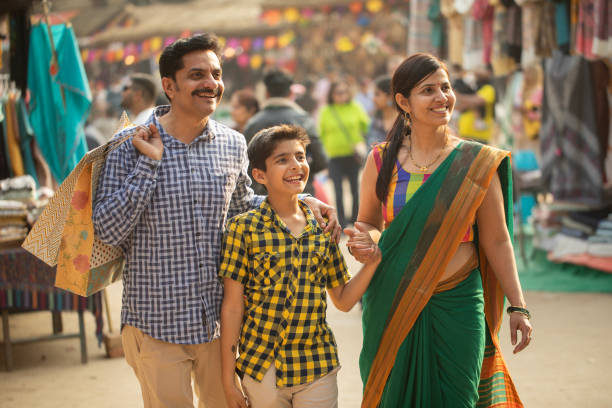 istock Parents with boy looking away and enjoying at carnival 2065806302