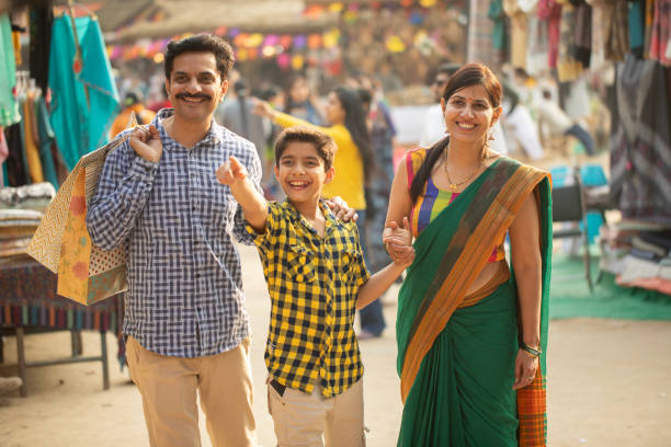 istock Parents with boy looking away and enjoying at carnival 2065806377