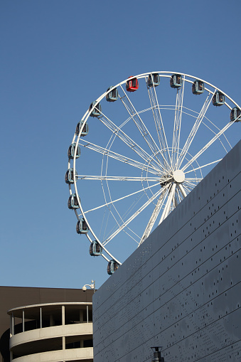 a giant wheel against blue sky sunny day