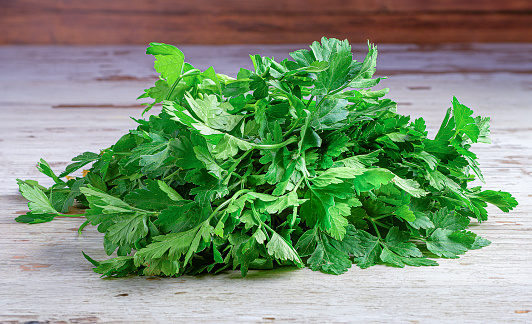 A Pile of Parsley on a Wooden Surface