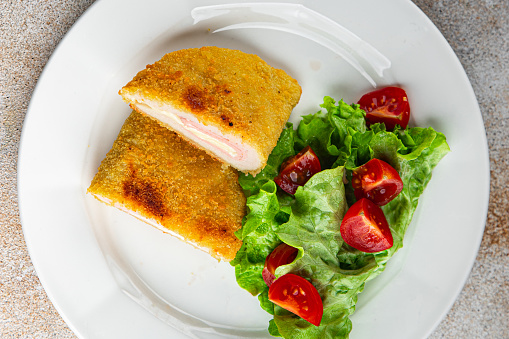 cutlet cordon bleu chicken meat, ham slice, cheese fresh food tasty eating cooking appetizer meal food snack on the table copy space food background rustic top view