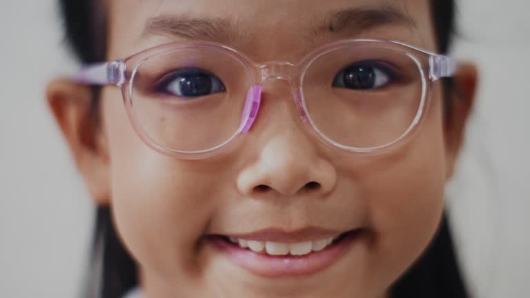 Asian teenage girl wearing glasses