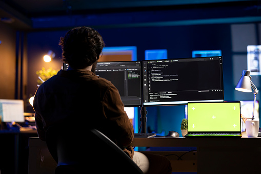 Programmer Green Programmer Using Green Screen Laptop To Implement Security Measures ...