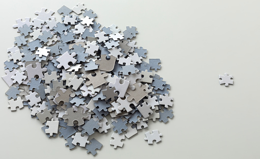 Jigsaw puzzle pieces on white background.