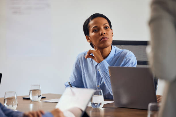 istock Focused African businesswoman, talking to her colleague. 2065959708