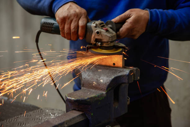 istock Heavy industry worker cutting steel with an angle grinder. 2065985437