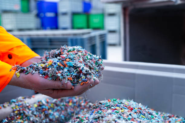 istock Plastic Resin pellets in holding hands. 2065999665