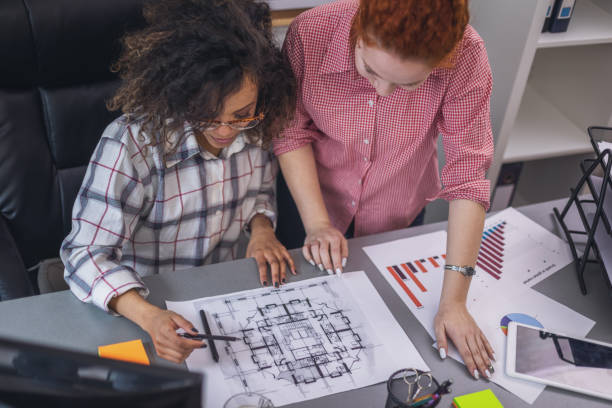 istock Two young women working together in the office 2066016071