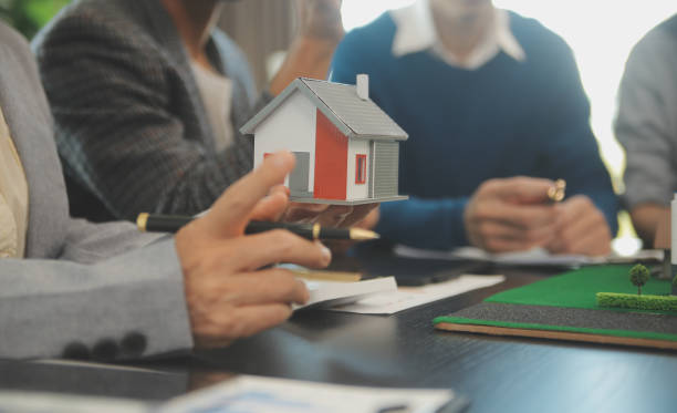 istock Team of architectures and businessmen discussing and brainstorming on floor plan modification for real estate investment and housing development project 2066026067