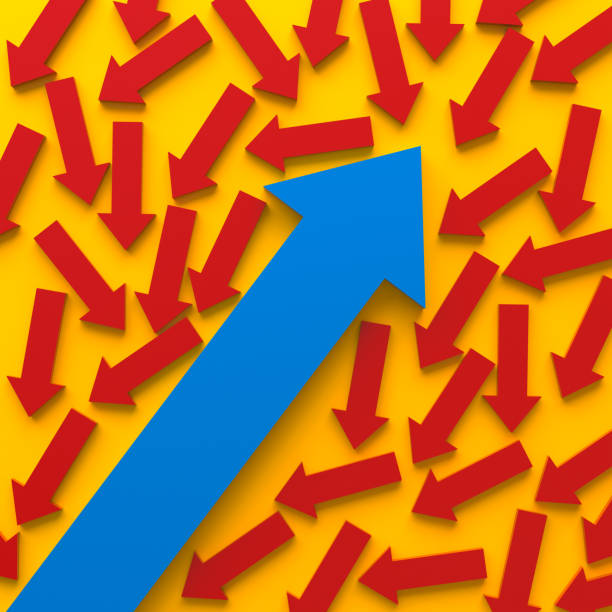 istock Blue arrow rising amidst red arrows 2066047826