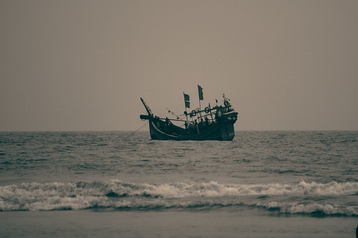 A fishing boat on the Bay of Bengal, view from Inani beach, Cox's Bazar