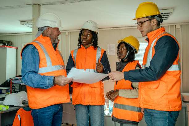istock Joyful Construction Team Reviewing Plans 2066130495