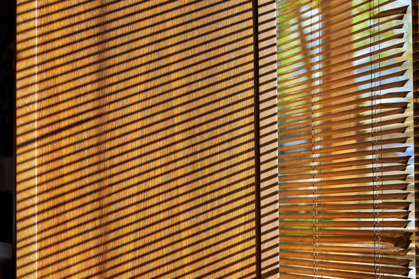 istock shadows from the blinds on the window slope 2066132045