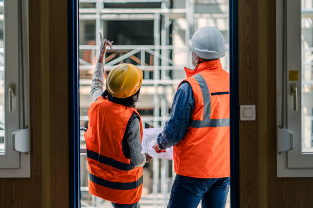 istock Workers Engaged in Discussion In Front of Construction Conteiner 2066135668