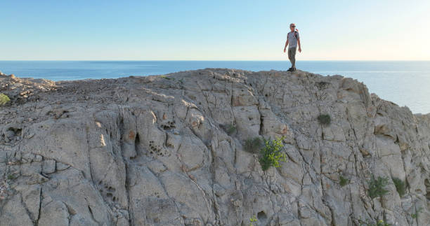 Free Stock Photo of Backside View of man standing on Rock | Download ...