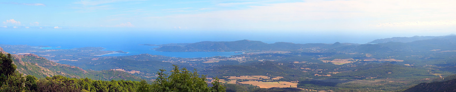 panoramic view of the eastern coast of Corsica, nicknamed the Isle of Beauty, from the charming belvedere village of Prunelli. We see a large part of the plain, the island of Elba and Montecristo. On a clear day mainland Italy can be seen.