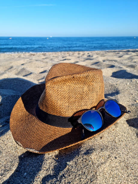 Travel, a hat in the sand on the beach