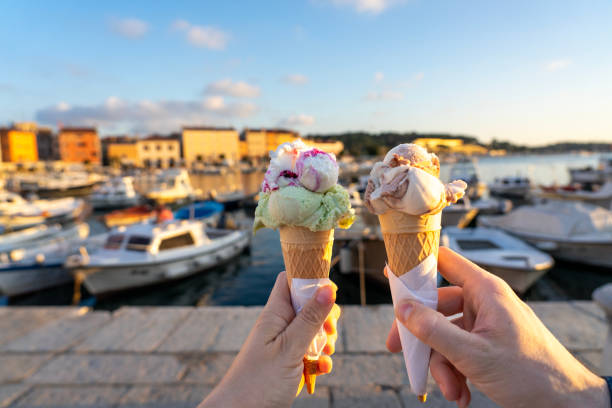 istock couple eating ice cream in Rovinj harbor with sunlight 2066218831