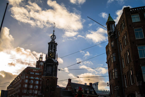 Explore the charm and architectural heritage of Amsterdam through its vibrant streets, where iconic buildings paint a picturesque cityscape.
