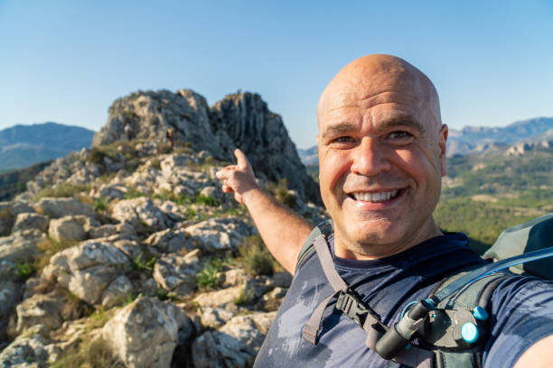 istock happy hiker takes a selfie on the mountains 2066225731
