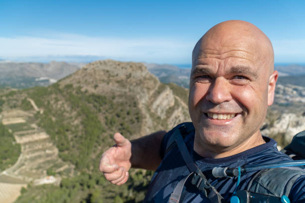 istock happy hiker takes a selfie on the mountains 2066225736