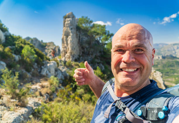 istock happy hiker takes a selfie on the mountains 2066225737