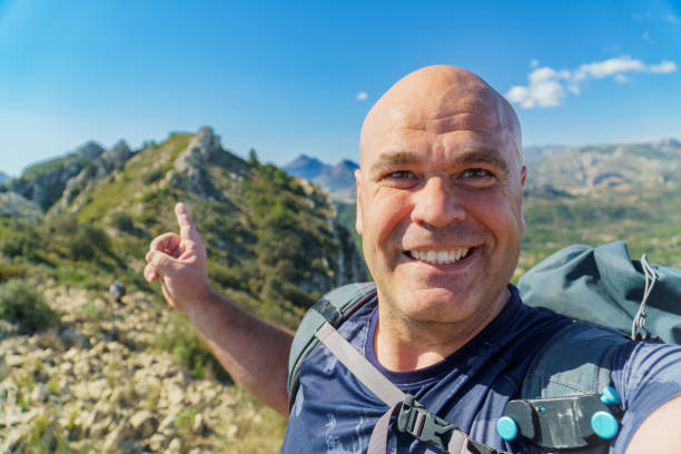 istock happy hiker takes a selfie on the mountains 2066226242