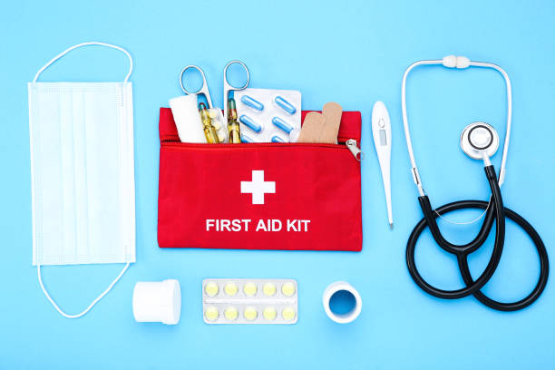 istock First aid kit with medical supplies on blue background 2066235544