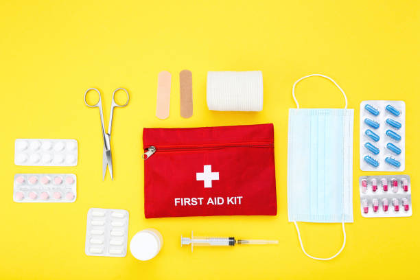 istock First aid kit with medical supplies on yellow background 2066242869