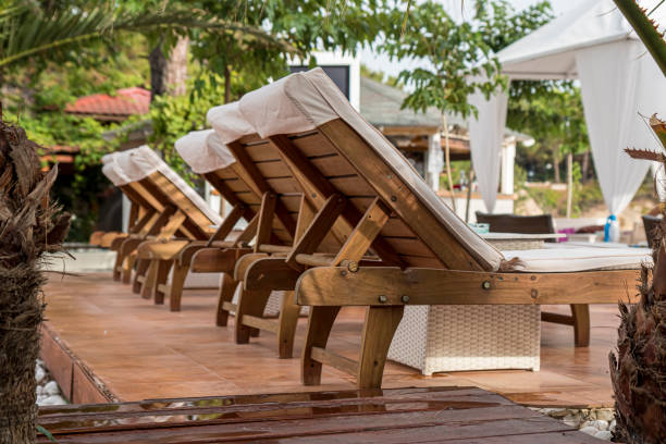 istock Sun umbrellas and sun beds on beautiful sandy beach at low angle. 2066244998