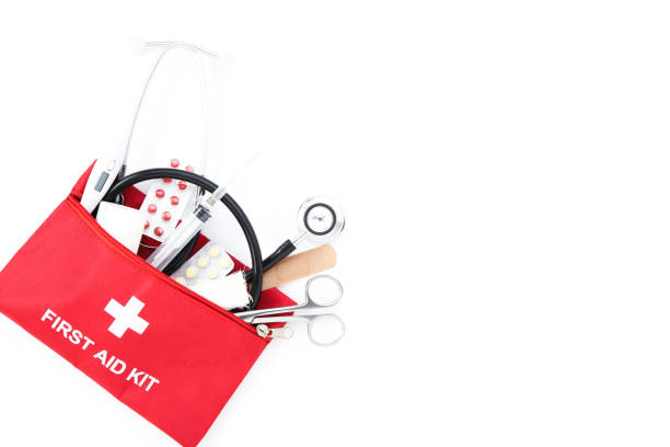 First aid kit with medical supplies isolated on white background