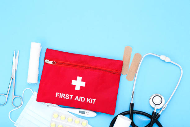 istock First aid kit with medical supplies on blue background 2066268700