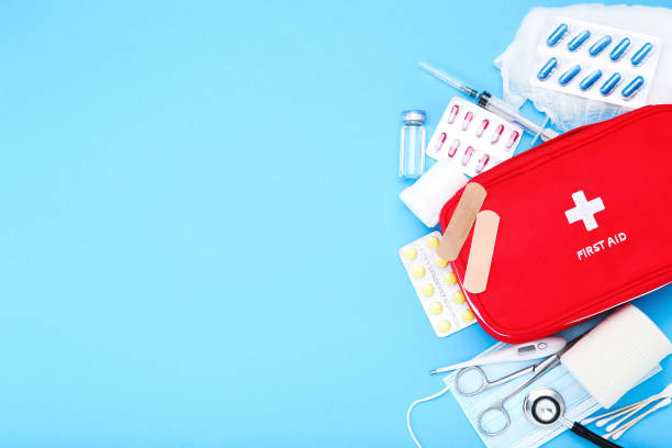 istock First aid kit with medical supplies on blue background 2066270480