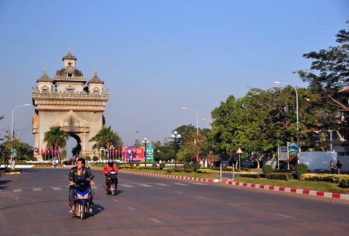 Vientiane, Laos:  Patuxai (literally Victory Gate or Gate of Triumph) - Patuxai was built in the 1960s to a design by Tham Sayasthsena, as a “Monument to the Heroes of the Royal Army”, celebrating Laos' independence from France (1949). It was popularly known simply as Anousavali (monument) or in French as the 'Monument Aux Morts'. In 1995, on the 20th anniversary of the seizure of power by the communists of Pathet Lao, the triumphal arch was given the new dedication to “The Heroes of August 23, 1975” (Day of the Communist seizure of power in Vientiane).