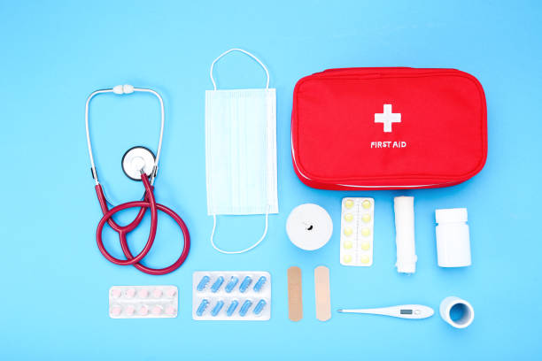 istock First aid kit with medical supplies on blue background 2066294129
