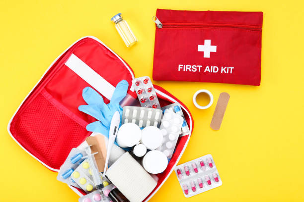 istock First aid kit with medical supplies on yellow background 2066294768