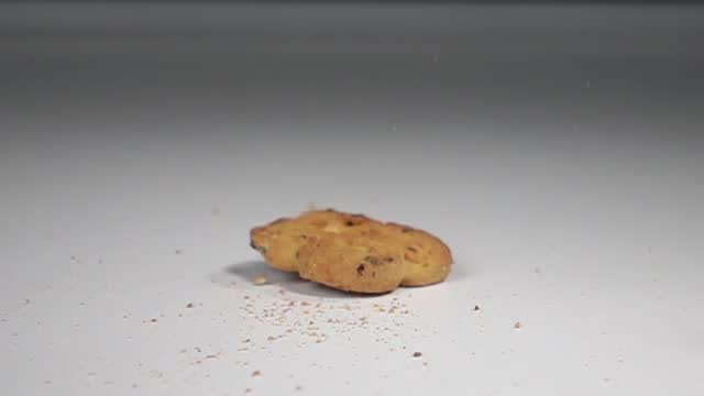 biscuit falling on table slow motion