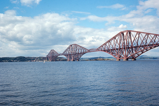 Forth Bridge is a cantilever railway bridge crossing the Firth of Forth and completed in 1890. Edinburgh, Scotland. Photo taken in October 1965. Scanned film.